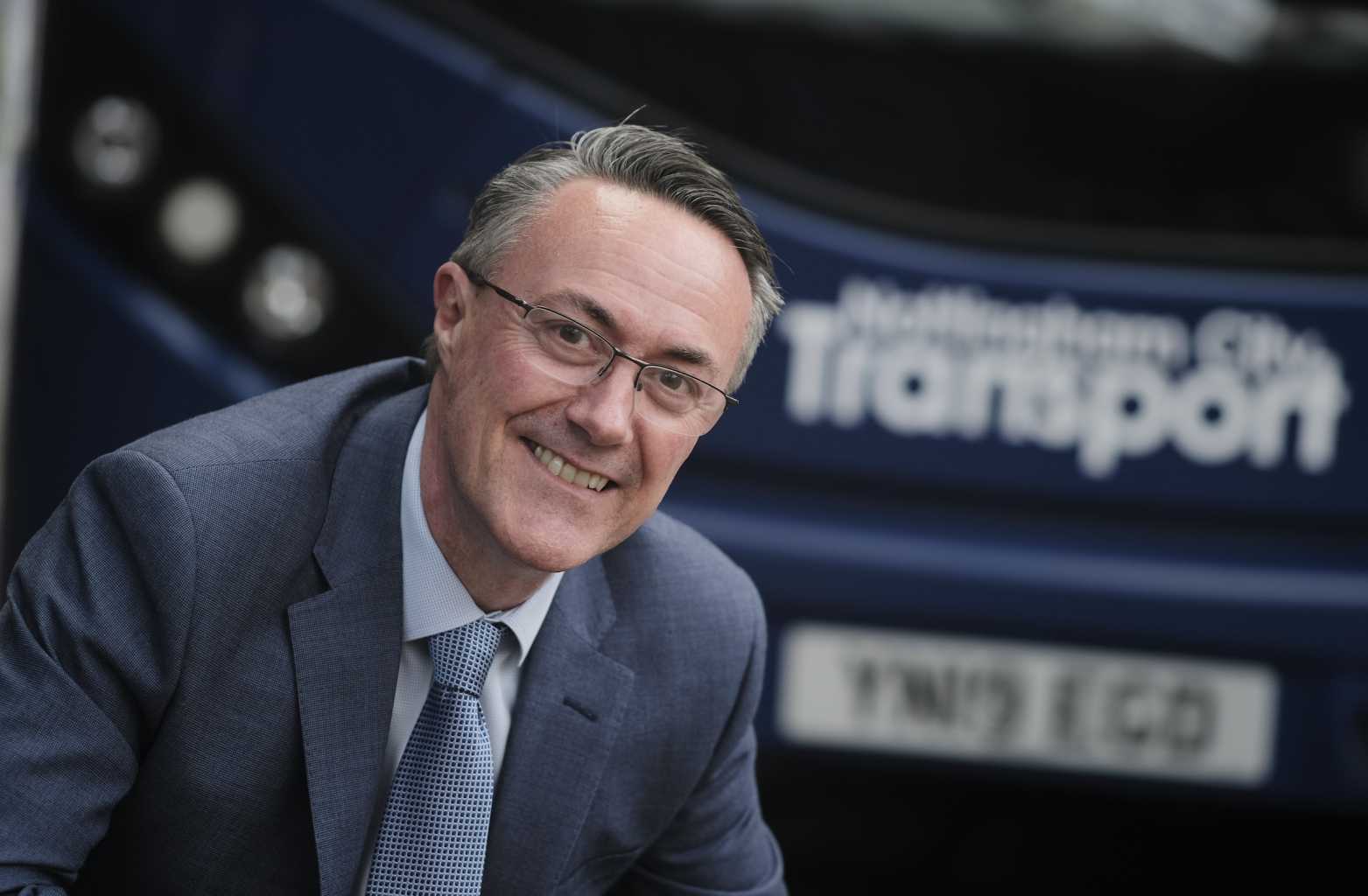 David Astill in front of NCT Bus