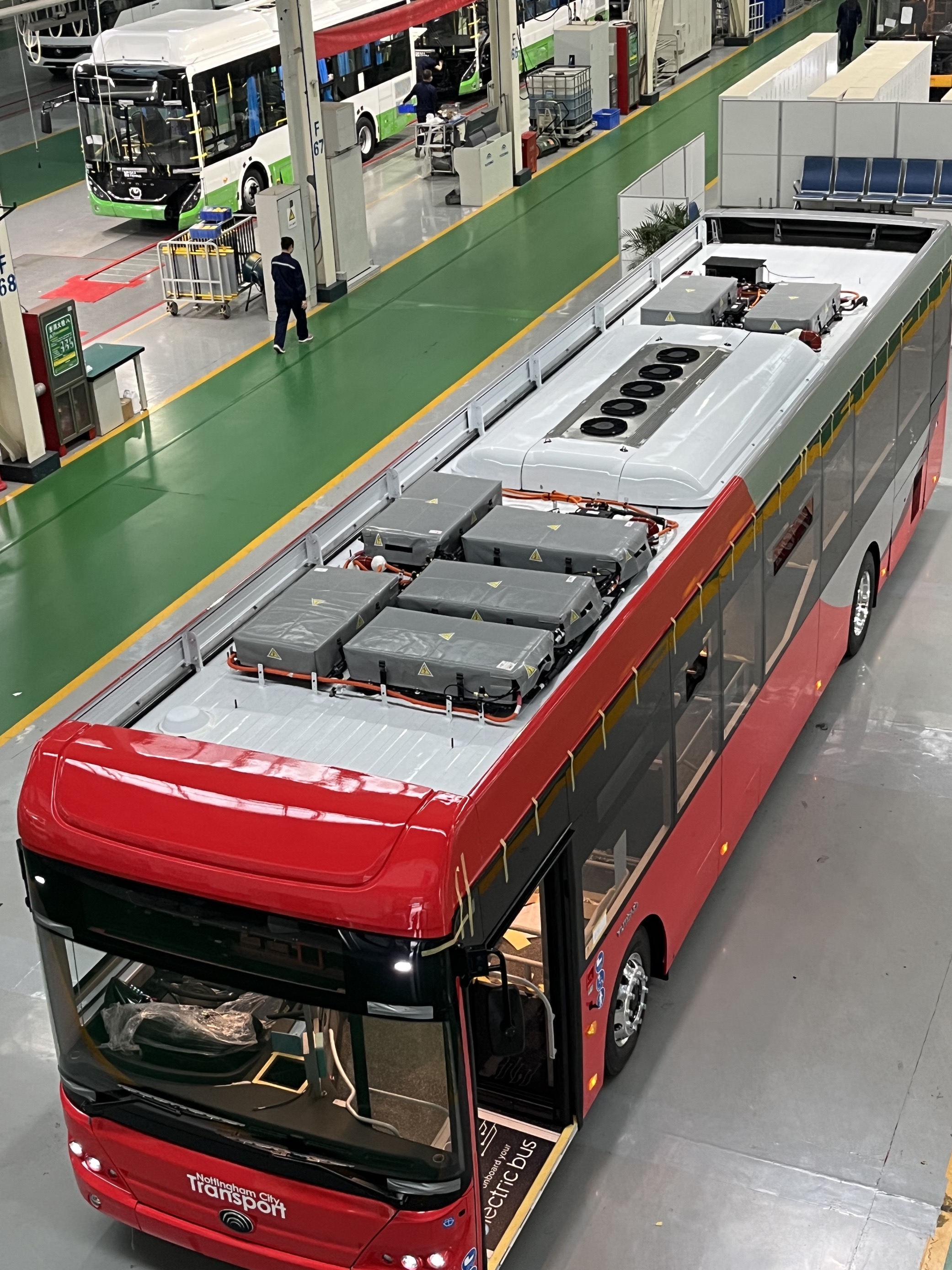 Overhead shot of the bus, showing seven batteries and air conditioning unit